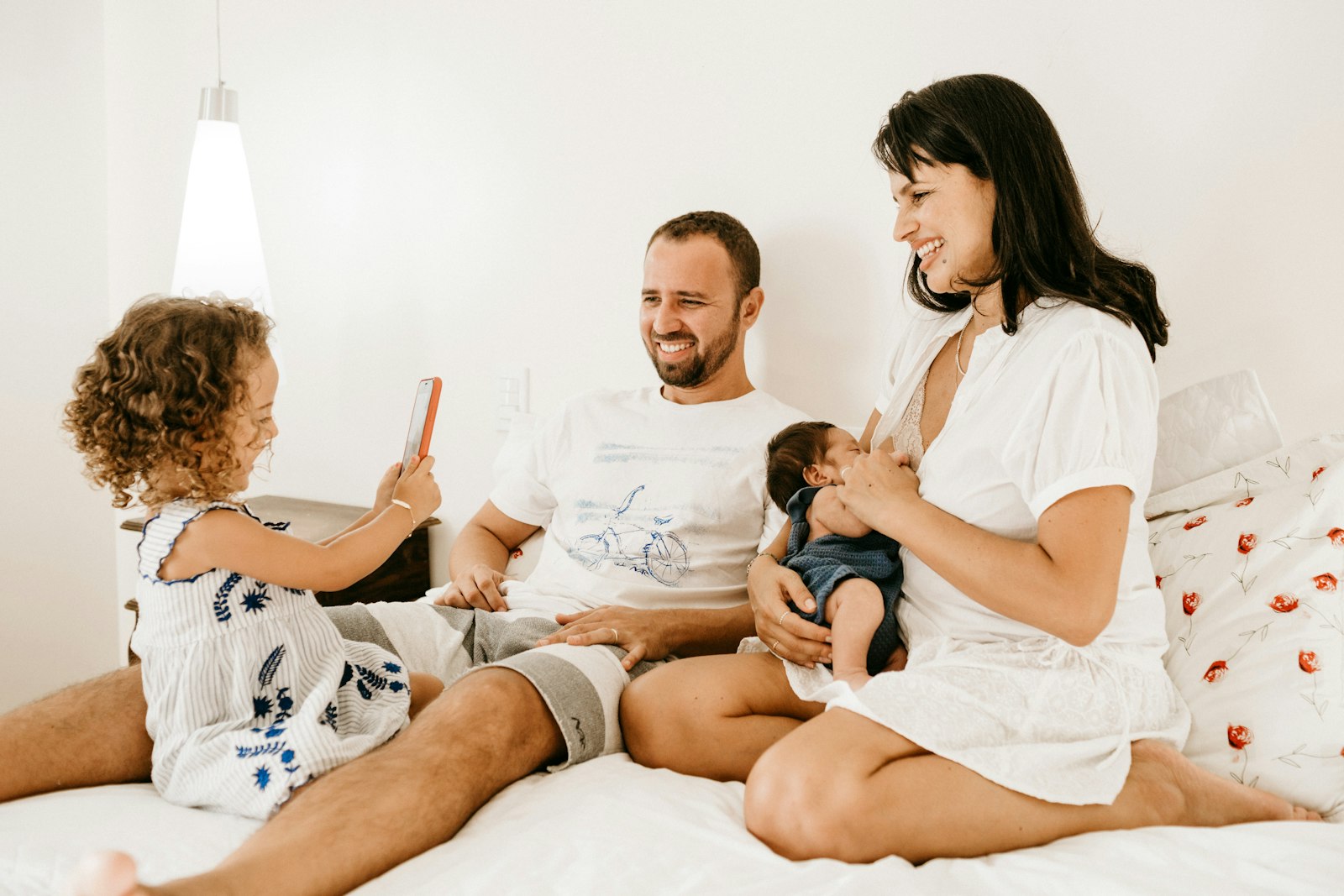 Parent and child smiling after in-home lice removal in Seattle